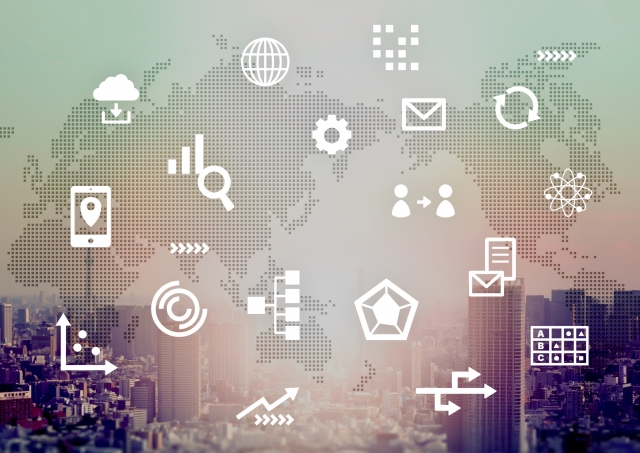 デジタルをイメージした各アイコンと世界地図、都市の背景画像